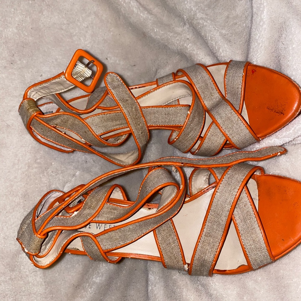 Orange and tan strappy sandals. Heels